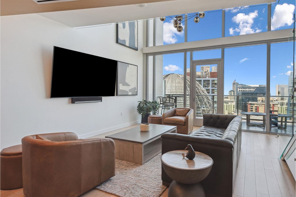 Living room with leather furniture at K1 Apartments, San Diego, 92101