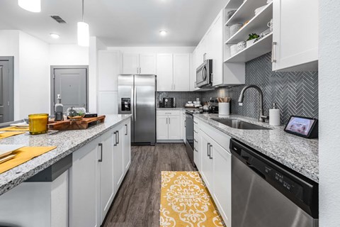 a kitchen with a counter top and a sink