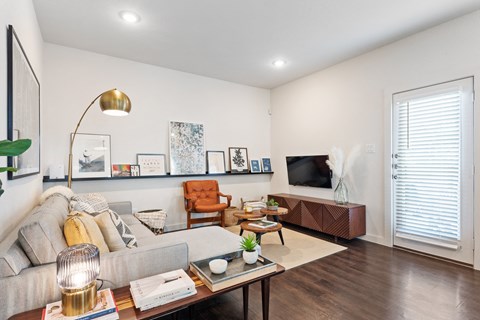 a living room with a couch and a tv