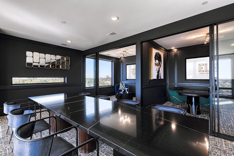 a conference room with a long table and chairs