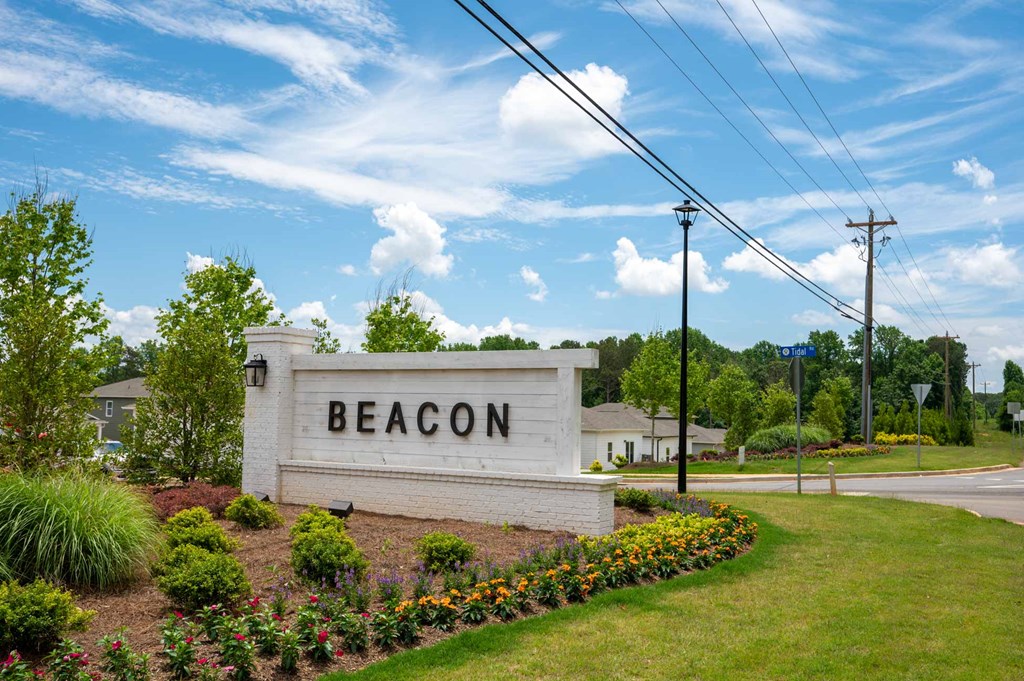 a sign that says beacon with a sign in front of it