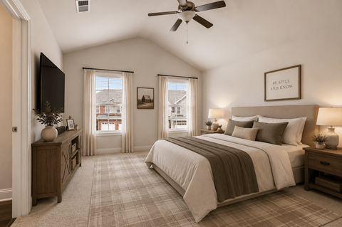 A bedroom with a large bed and a flat screen TV.