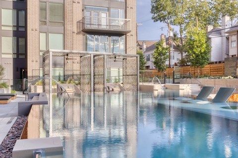 a swimming pool with a building in the background