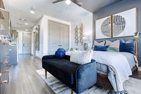 a bedroom with a couch and a bed