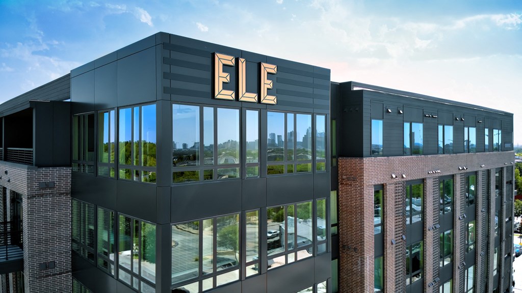 the facade of an office building with the ee logo on it