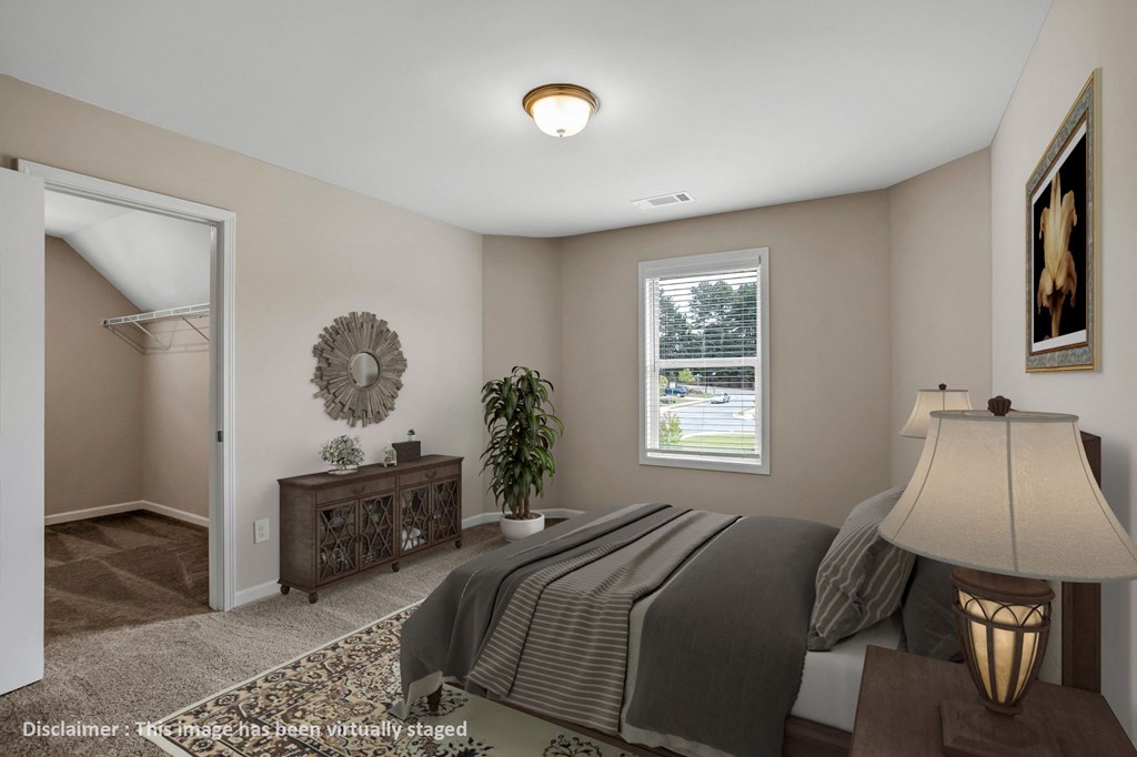 a bedroom with a large bed and a closet