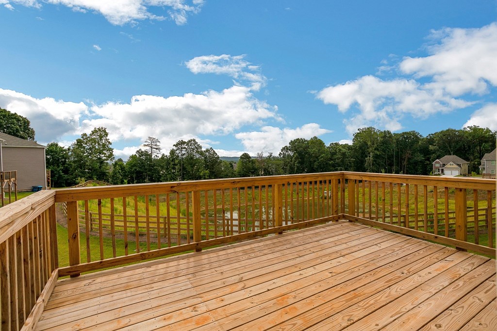 the deck has a view of the trees and the sky