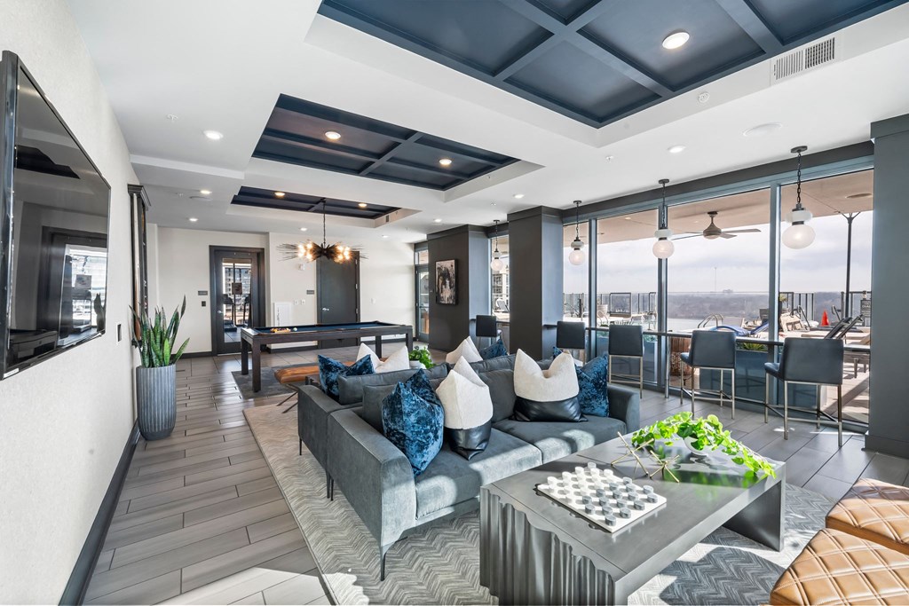 a living room with a gray couch and a table