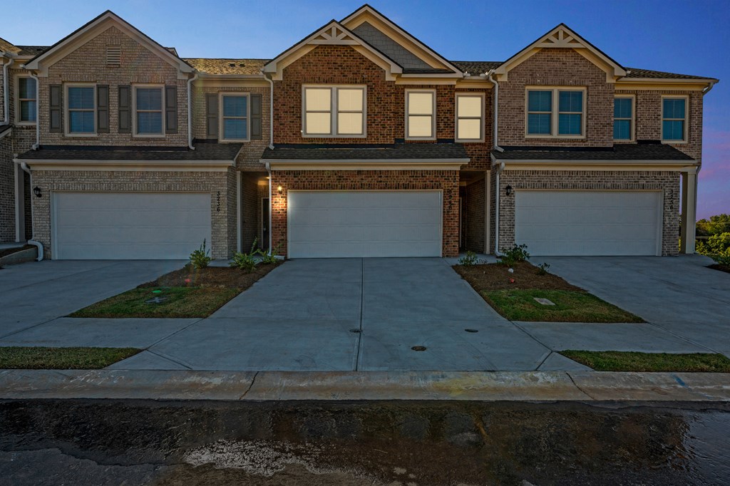 exterior night view of townhomes.