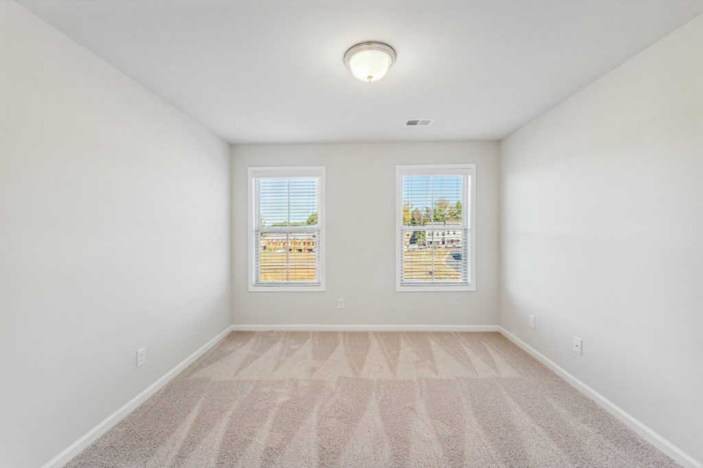 secondary bedroom with carpet