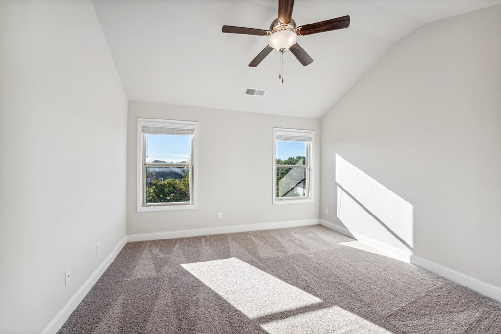 Primary bedroom with carpet