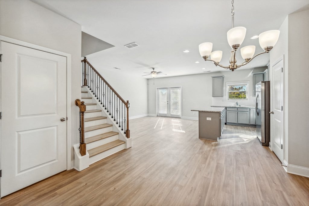 Entry to living area, kitchen and stairs to 2nd floor