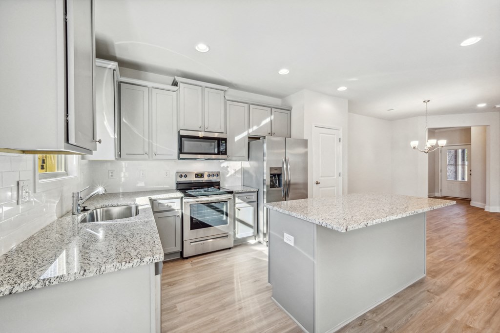 Kitchen view with island and stainless steel appliances