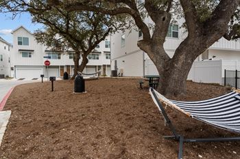 Courtyard With Mature Trees at Villae ATX Luxury Rental Townhomes, Manchaca, Texas