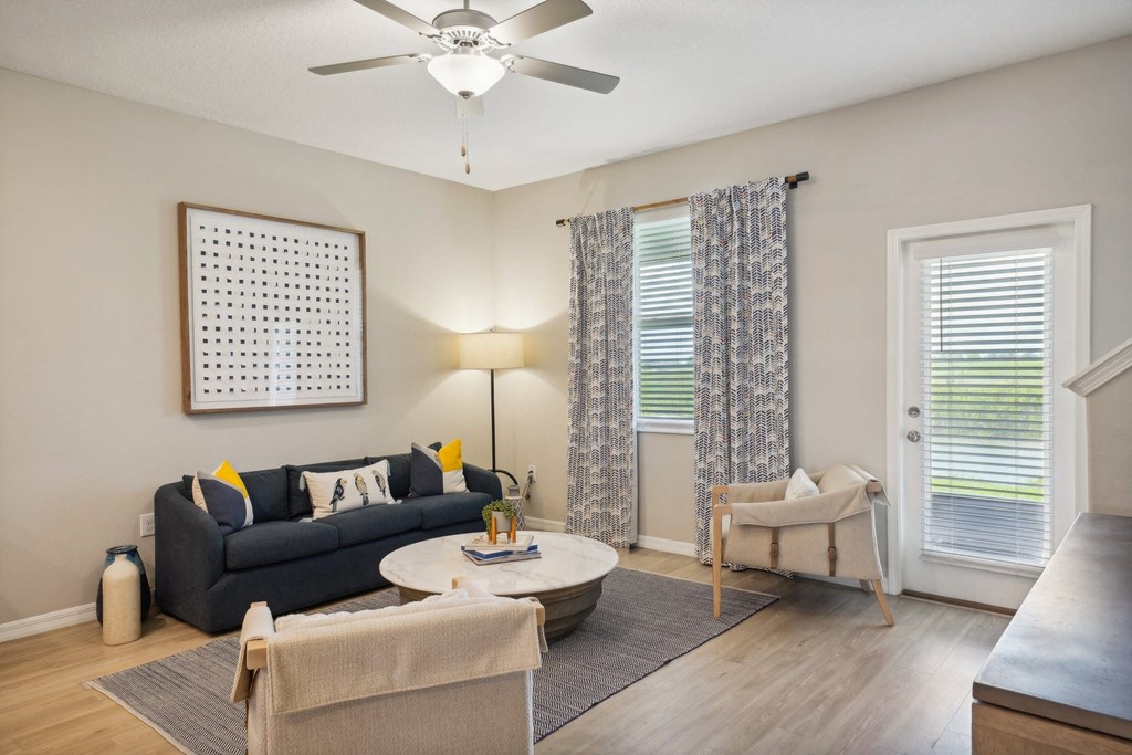 an open living room with a couch and a coffee table