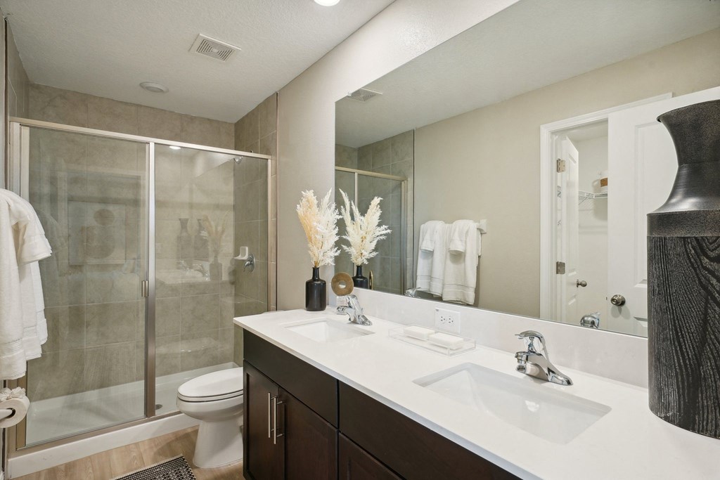 the preserve at ballantyne commons apartment bathroom with sink and shower