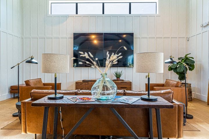 a living room with a table with a vase on it