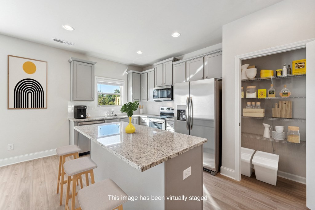 a kitchen with stainless steel appliances and a granite counter top