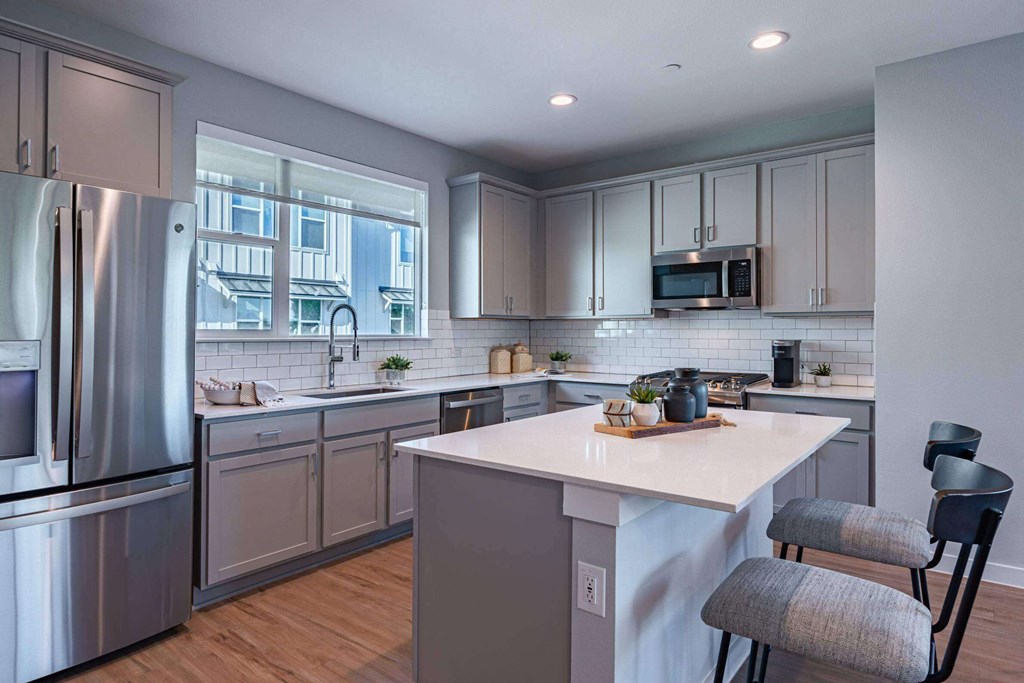 Modern Kitchen With Stainless Steel Appliances And Double Door Refrigerators Modern Kitchen With Stainless Steel Appliances And Double Door Refrigerators at Villae ATX Luxury Rental Townhomes, Manchaca, TX, Texas, 78652