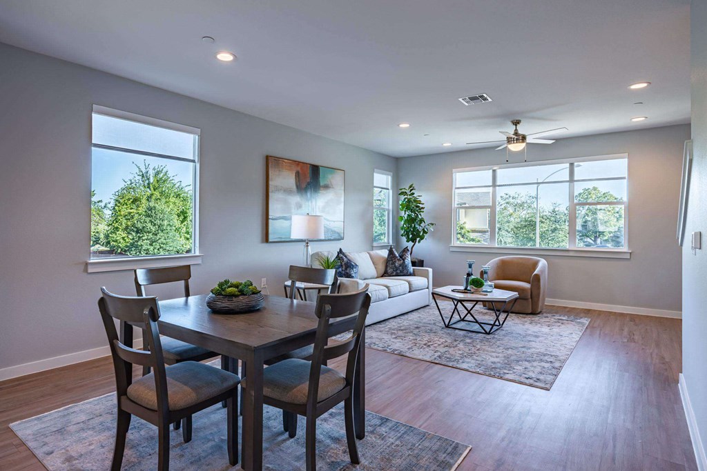 Living Room With Expansive Window and dining area Living Room With Expansive Window and dining area at Villae ATX Luxury Rental Townhomes, Manchaca, 78652
