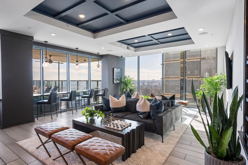 a living room with couches and chairs and a table