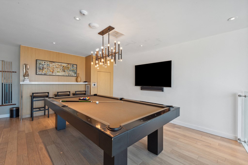 Pool table in a living room at K1 Apartments, San Diego
