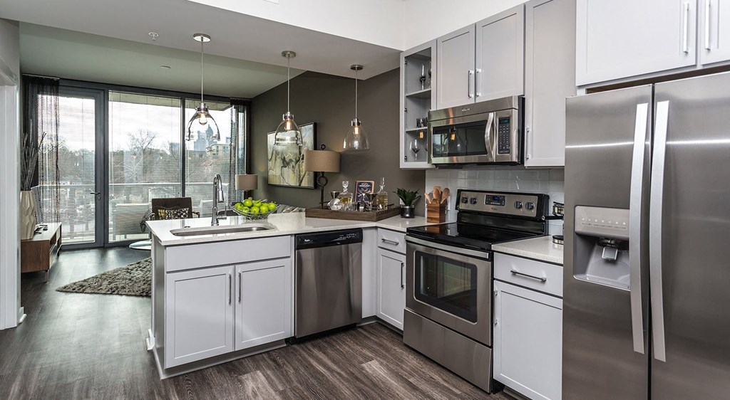 a kitchen with stainless steel appliances and a sink