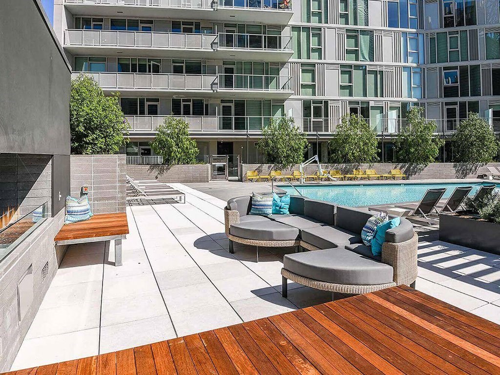 sunlit modern lounges by pool at K1 Apartments, San Diego, CA