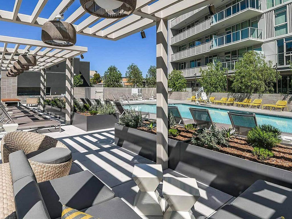 shaded pool deck lounge at K1 Apartments, San Diego, CA 92101