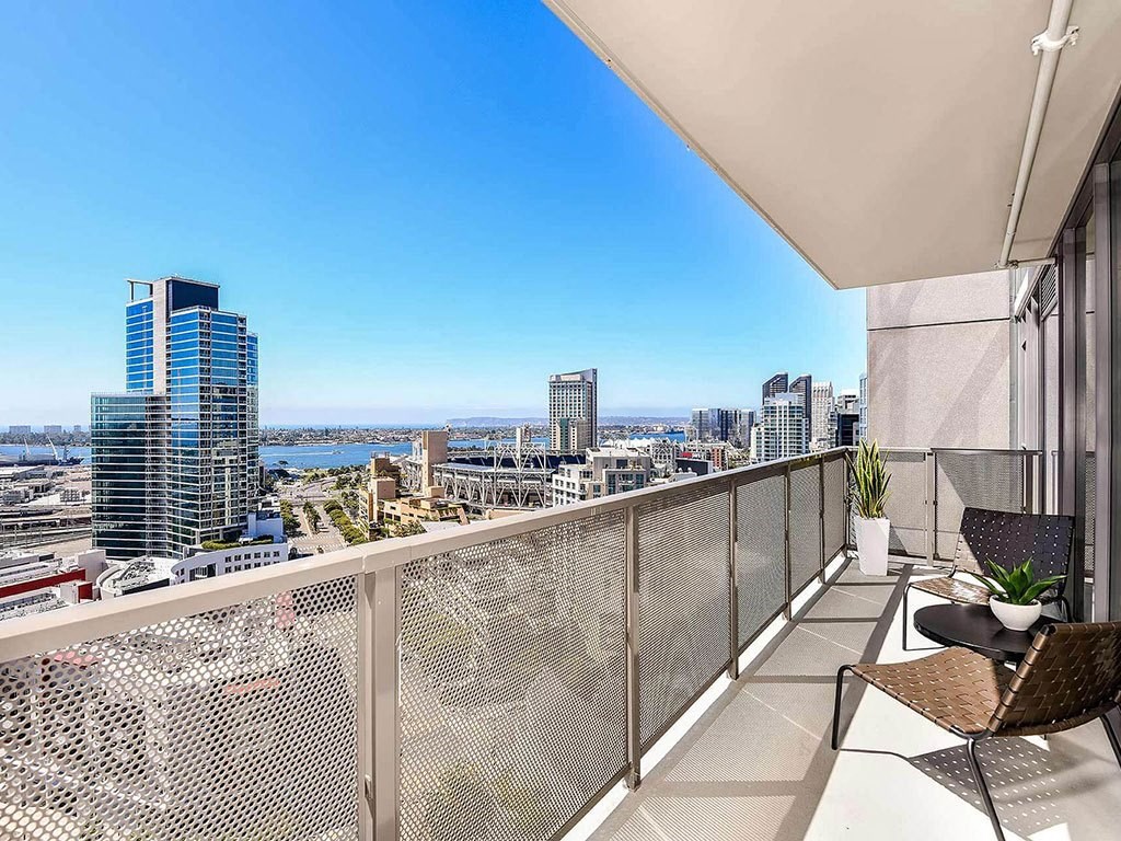 Large balcony with city views at K1 Apartments, San Diego, CA