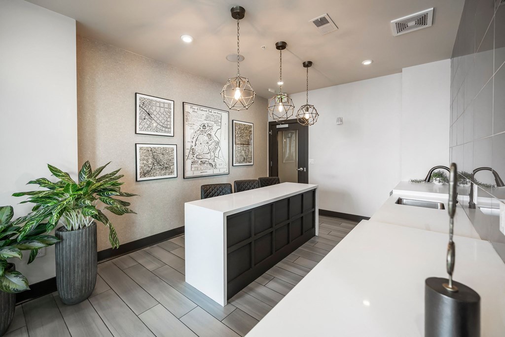 a lobby with a white counter top and a sink