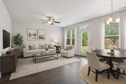 A living room with a white couch and a coffee table.
