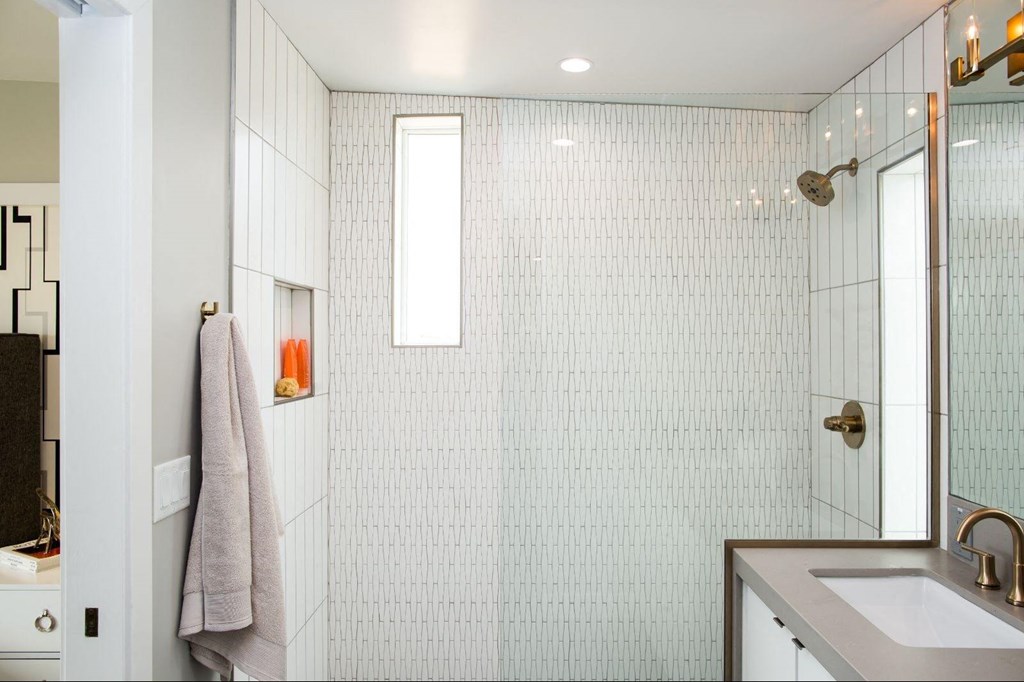 a white bathroom with a shower and a sink at Novella Arcadia, Arizona