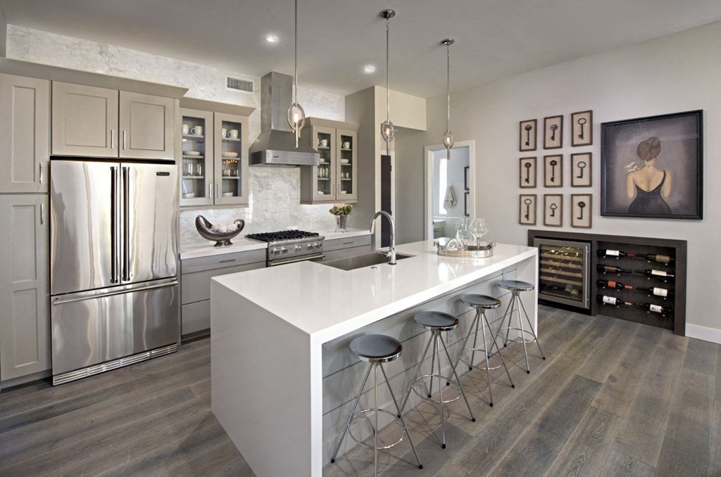 a kitchen with a large island and stainless steel appliances at Novella Arcadia, Phoenix Arizona