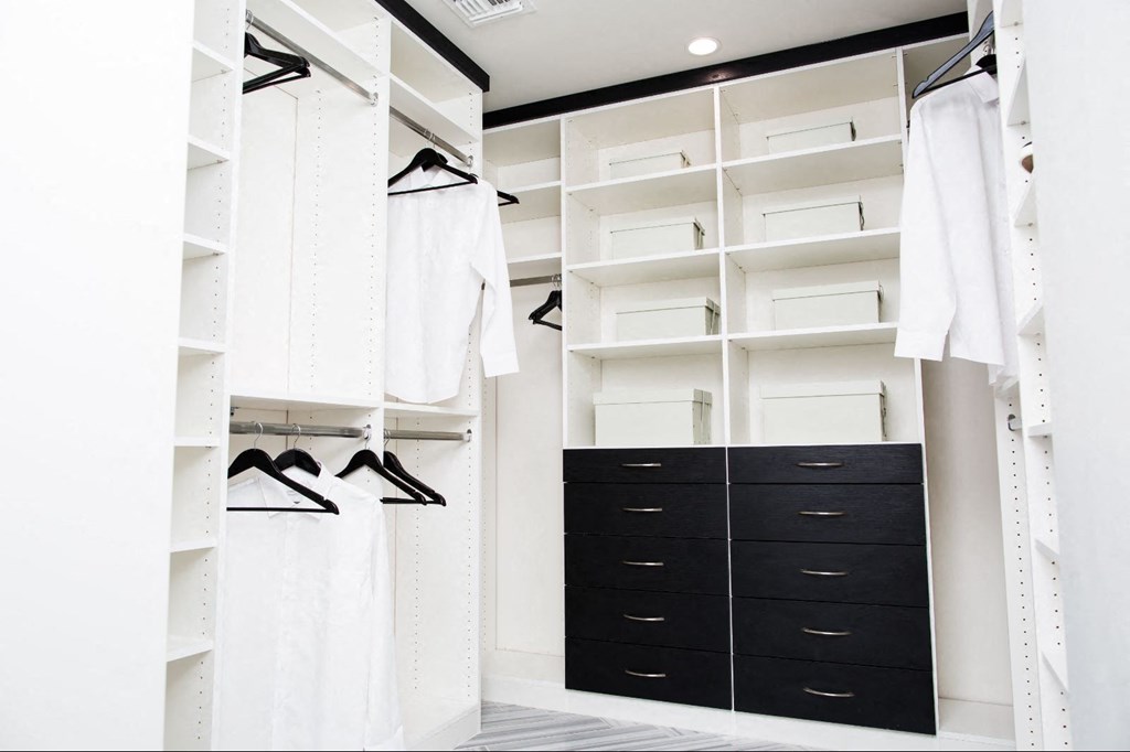 a large closet with black drawers and white closets at Novella Arcadia, Phoenix