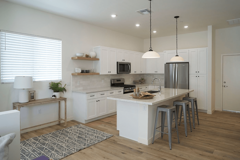 a kitchen with a center island and a counter top at Novella Biltmore, Phoenix, AZ 85016