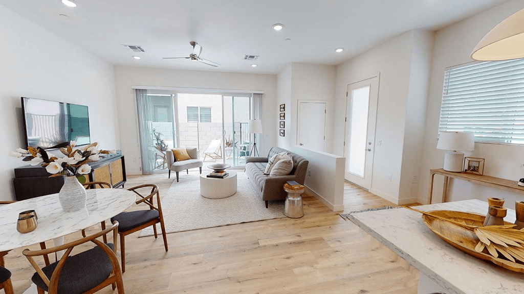 a living room with a couch and a table at Novella Biltmore, Phoenix, 85016