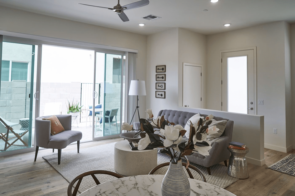 a living room with a couch and a table at Novella Biltmore, Phoenix