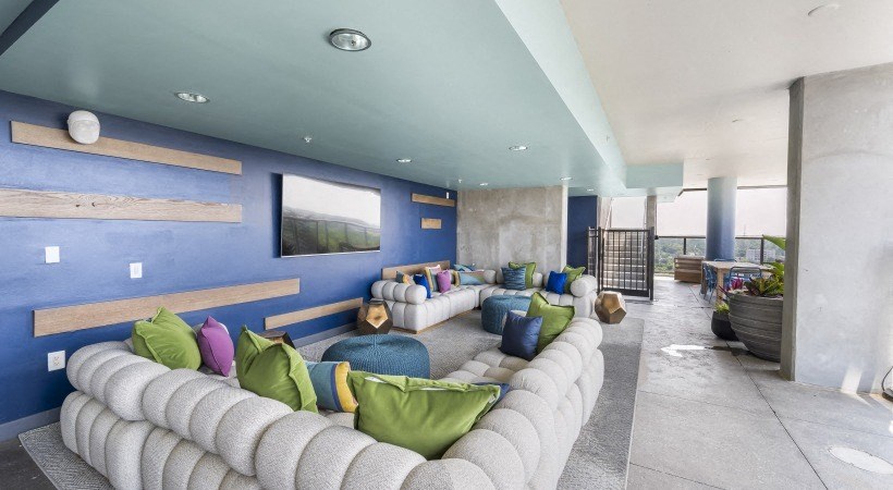 a living room with blue walls and a white couch