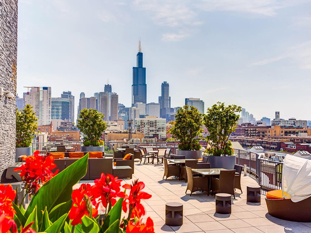 Rooftop lounge area with Chicago skyline views  at The Madison at Racine, Chicago, IL
