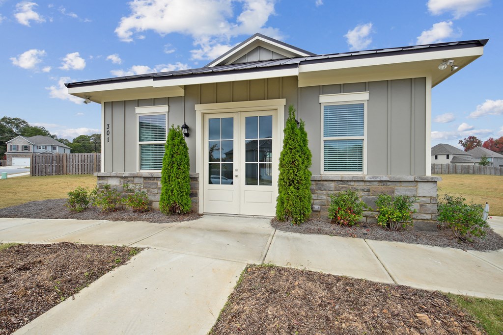 an exterior view of a home with a walkway and a driveway
