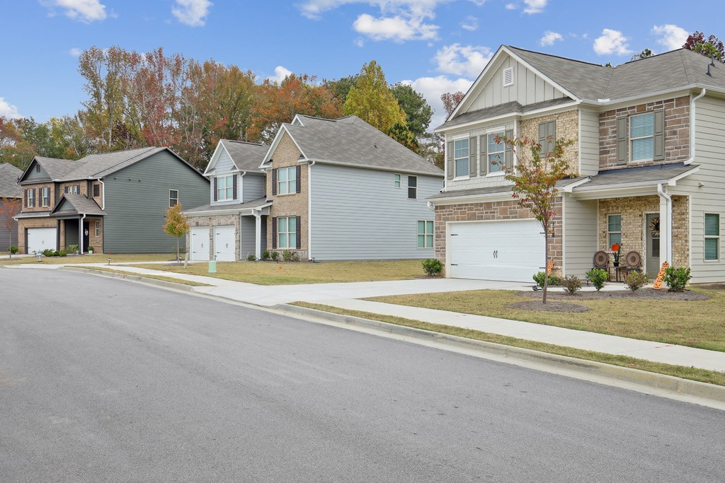 a row of houses on the side of a street