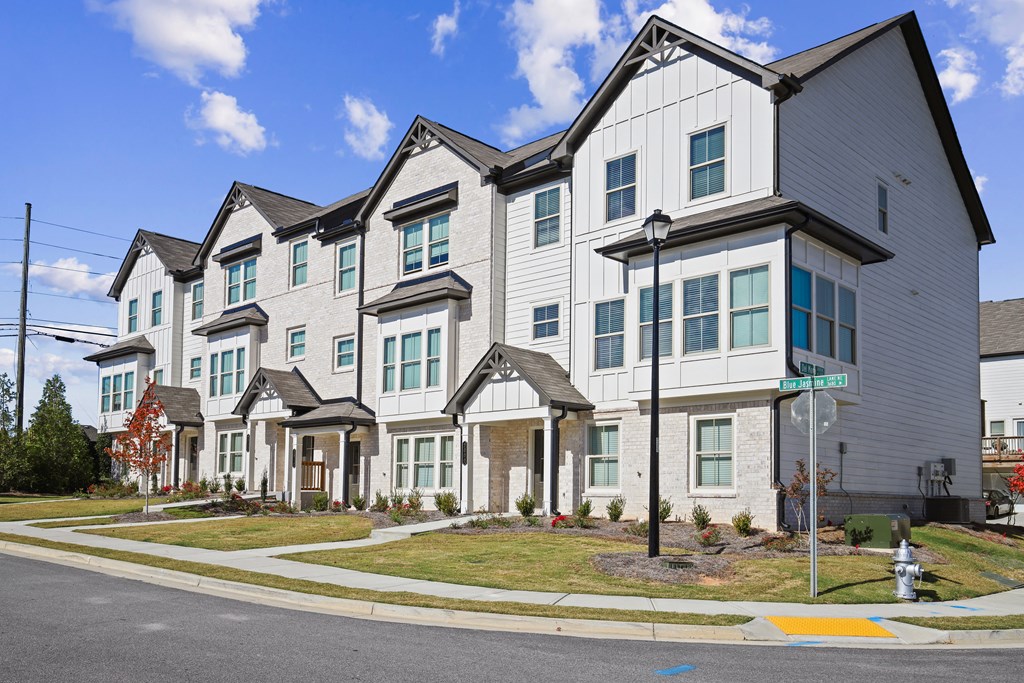 a row of town homes on a street corner