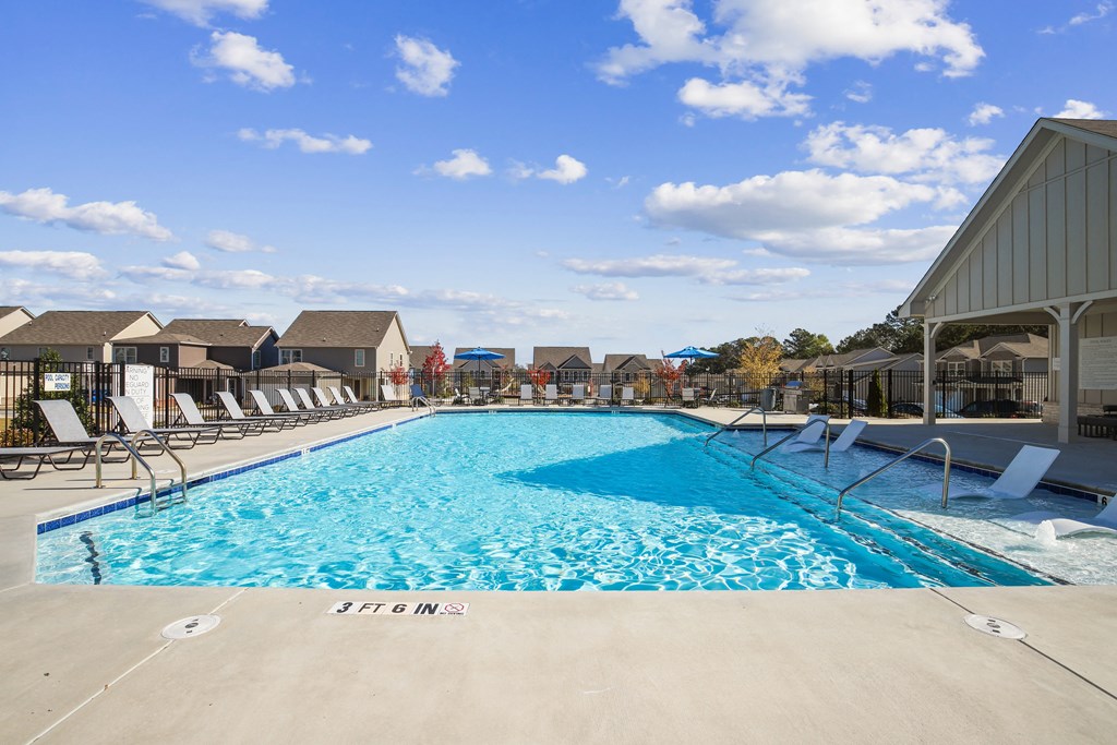 the swimming pool at the estates apartments