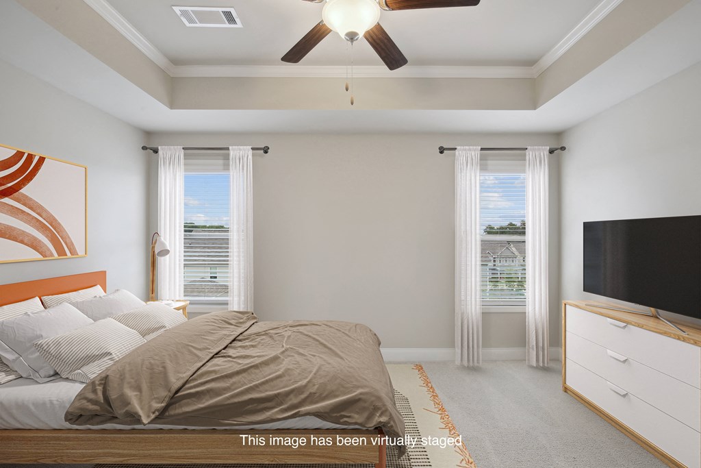 an image of a bedroom with a bed and a ceiling fan