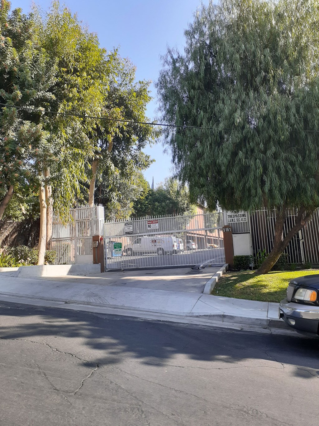 a car is parked in front of a gate