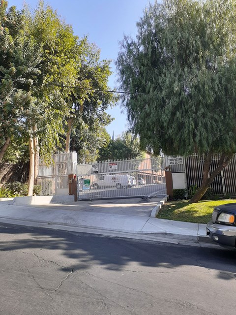 a car is parked in front of a gate