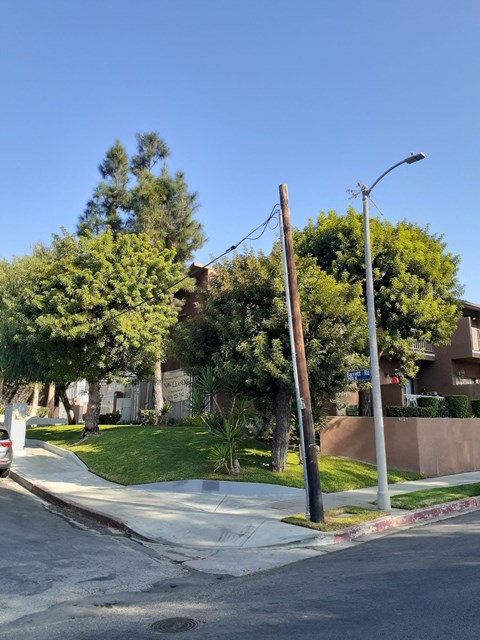 a power pole on the corner of a street