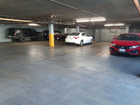 a parking garage with cars parked in it