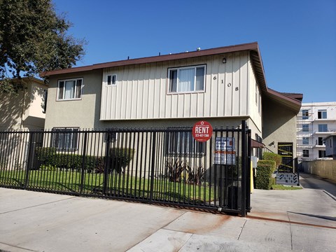 A house with a rent sign in front of it.